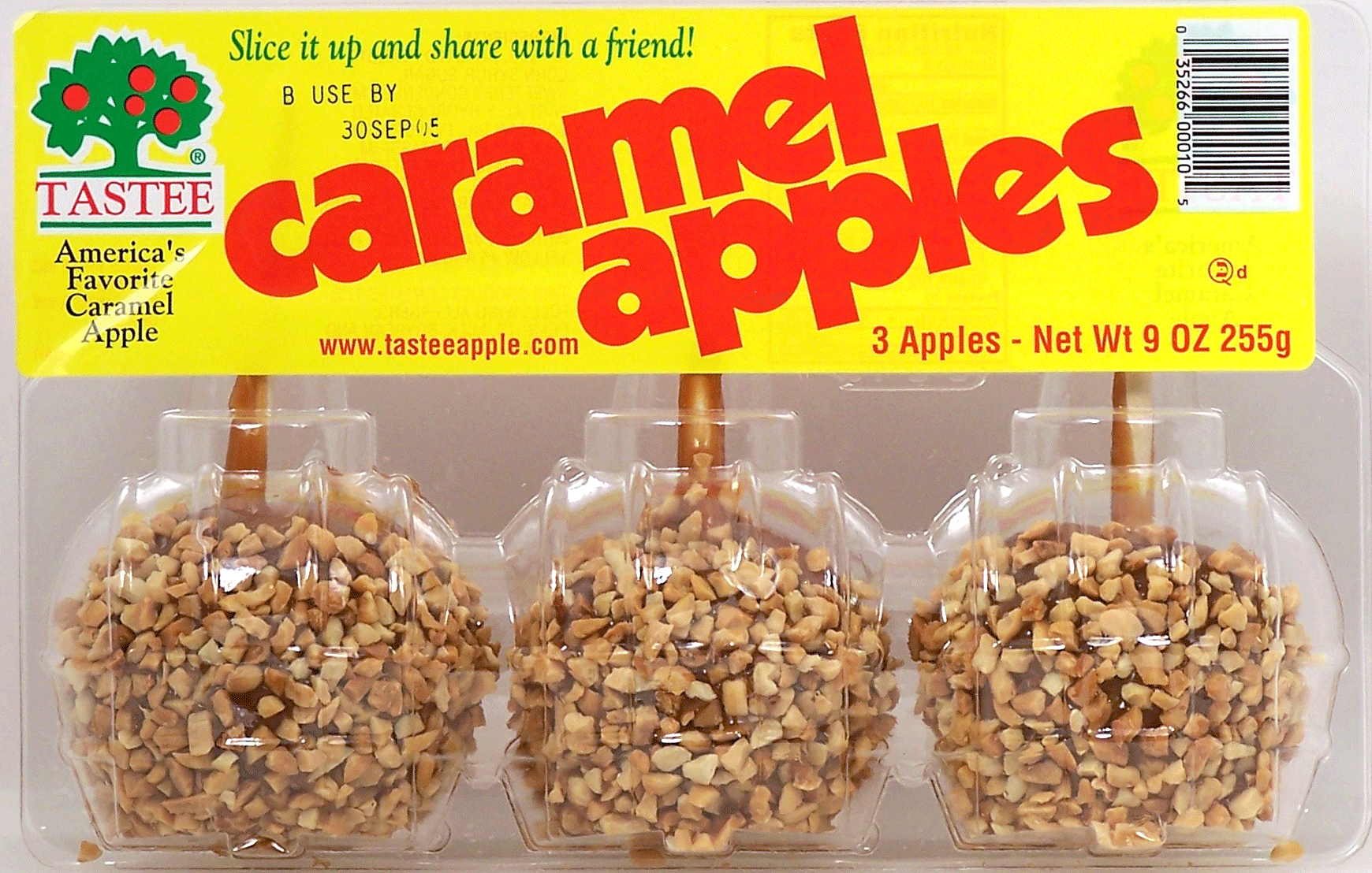 Tastee  3 apples dipped in caramel, and chopped nuts with sticks Full-Size Picture